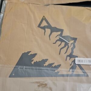 Black Metal Wall Art with Tree and Mountain Design